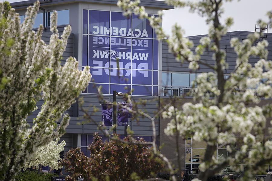 A purple banner on the University Center that says You Belong Here and Academic Pride.